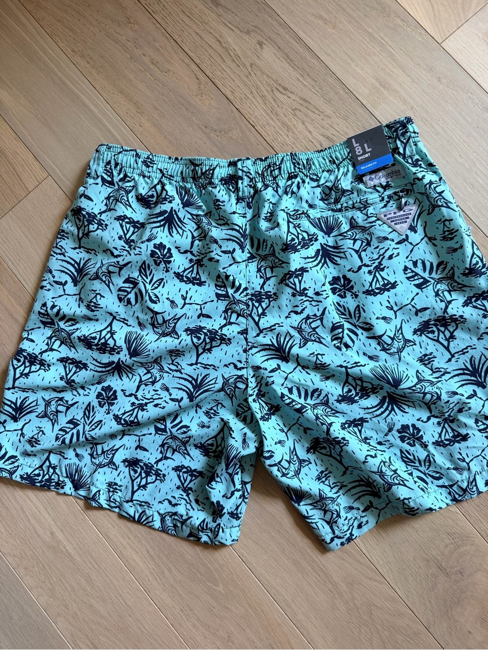 NWT size Large Columbia Men’s PFG Mint and Navy Floral Swim Trunks